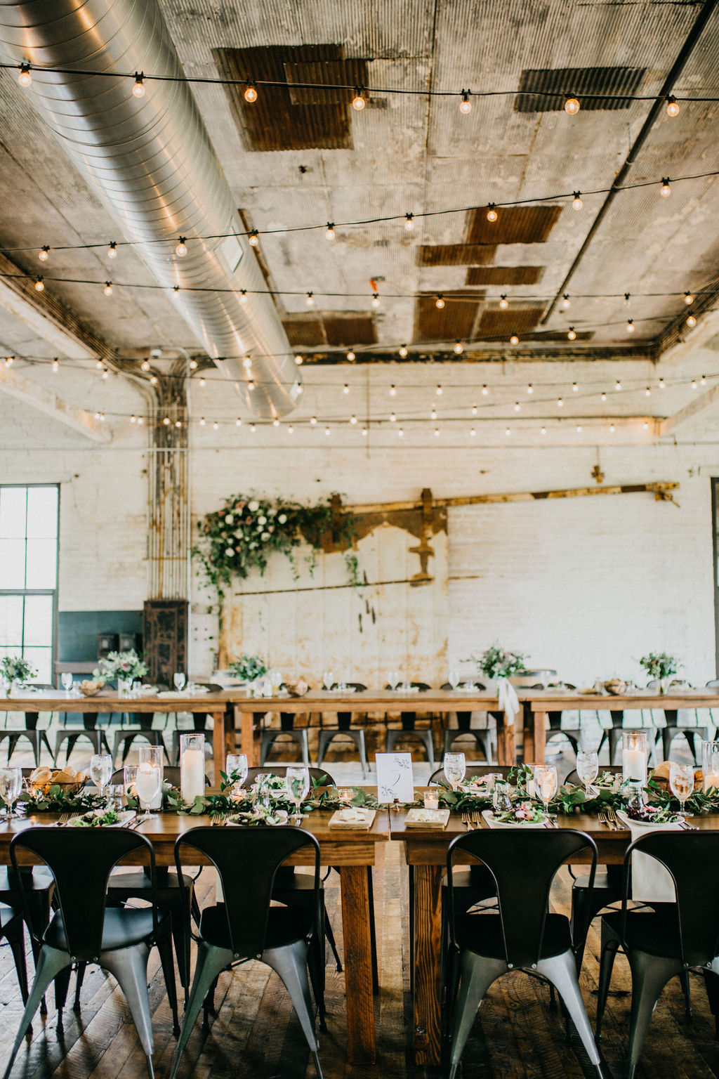 Tables set for a journeyman distillery wedding