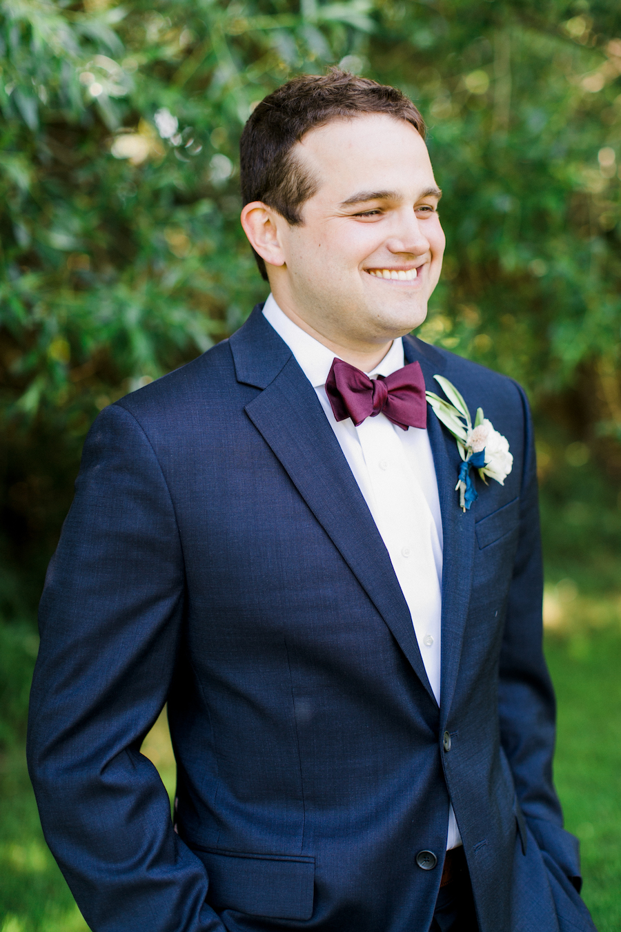 A groom smiling on his wedding day