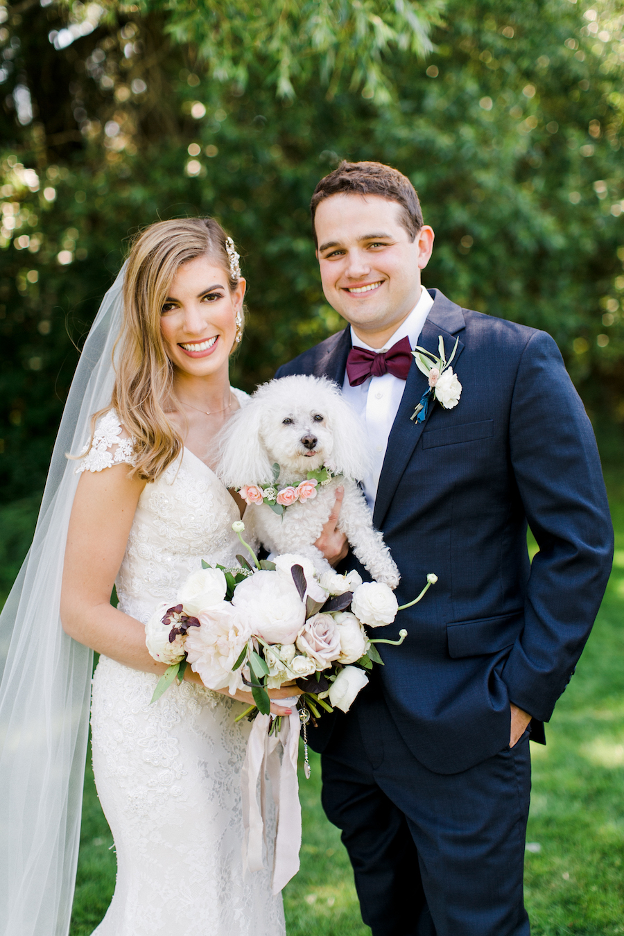 A bride, groom and their dog