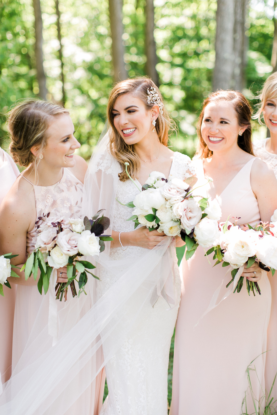 Bride and bridesmaids and their bouquets 