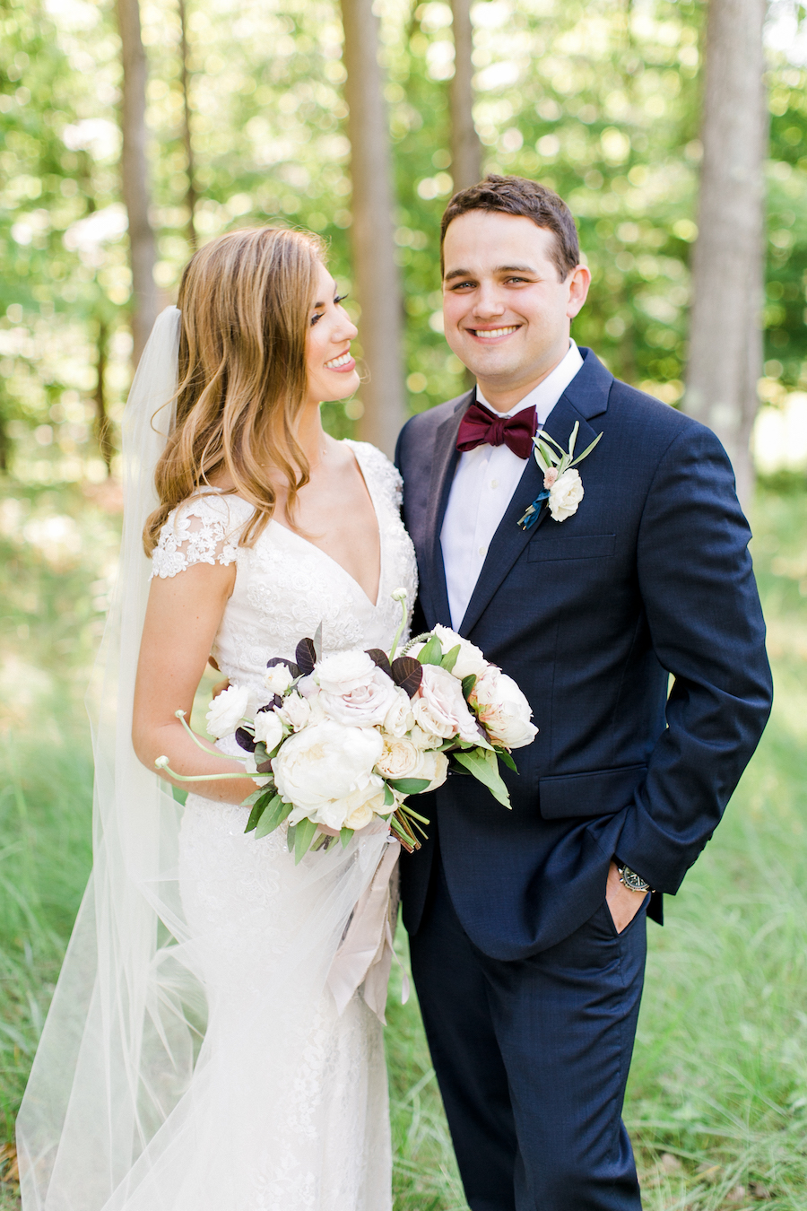 A bride and a groom smiling on their wedding day