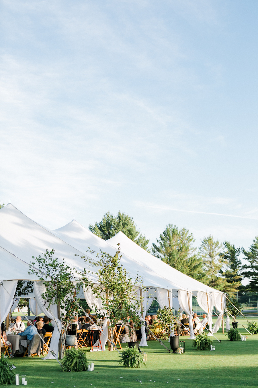 A garden themed outdoor tented wedding