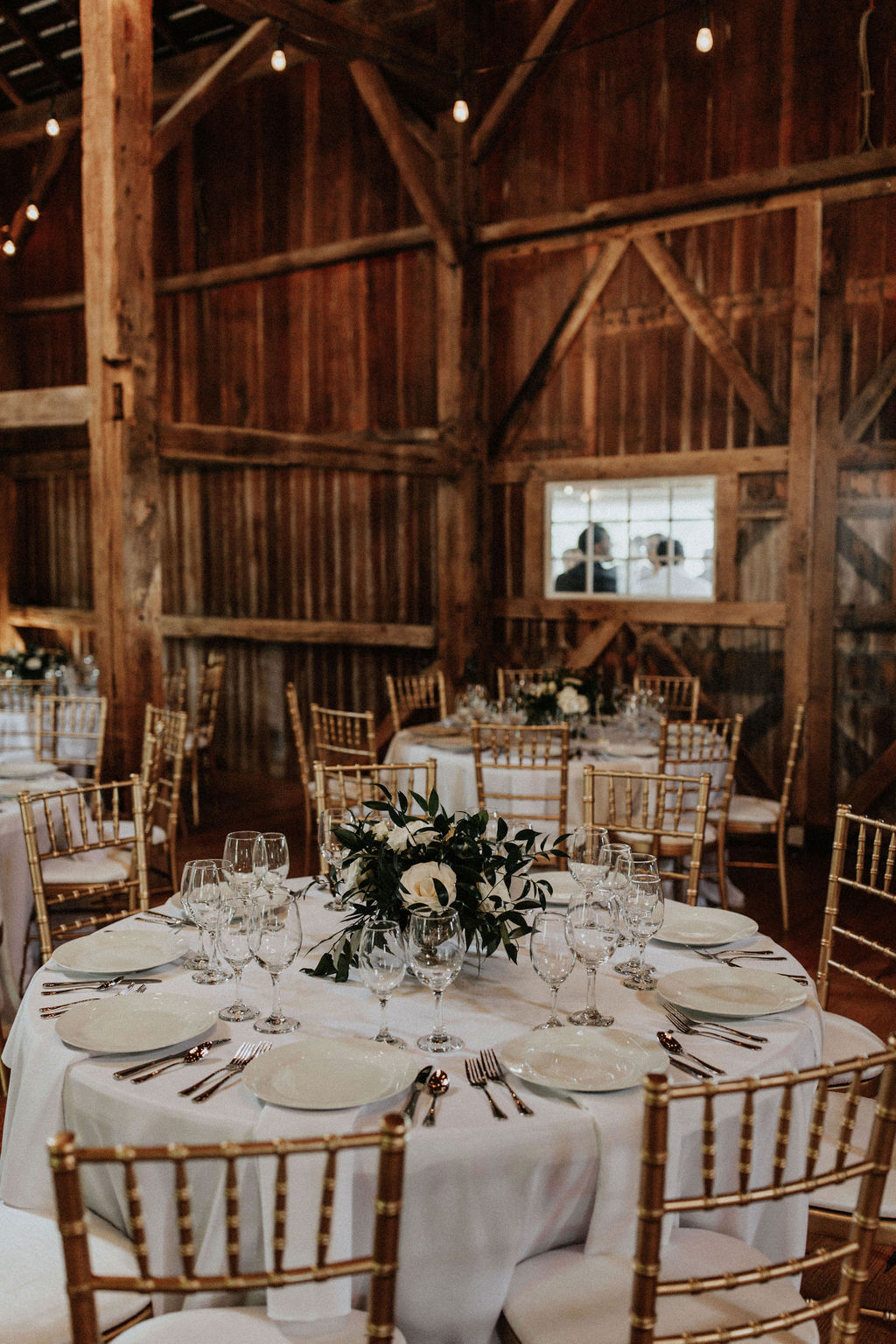 Tables set for a Hidden Vineyard Wedding Barn wedding reception.