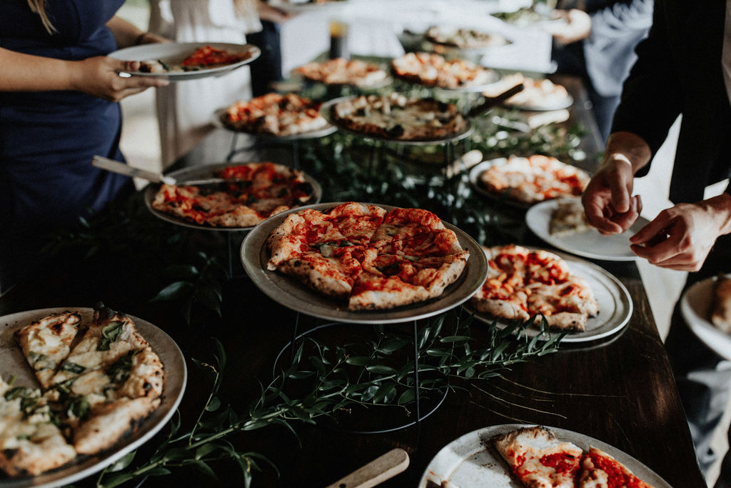 A pizza bar set at a wedding