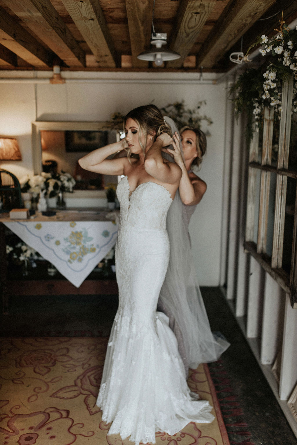 A bride and her mom getting ready for her wedding day