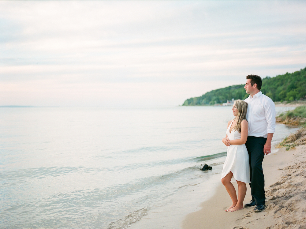 A couple enjoying the sunset in Glen Arbor, Michigan