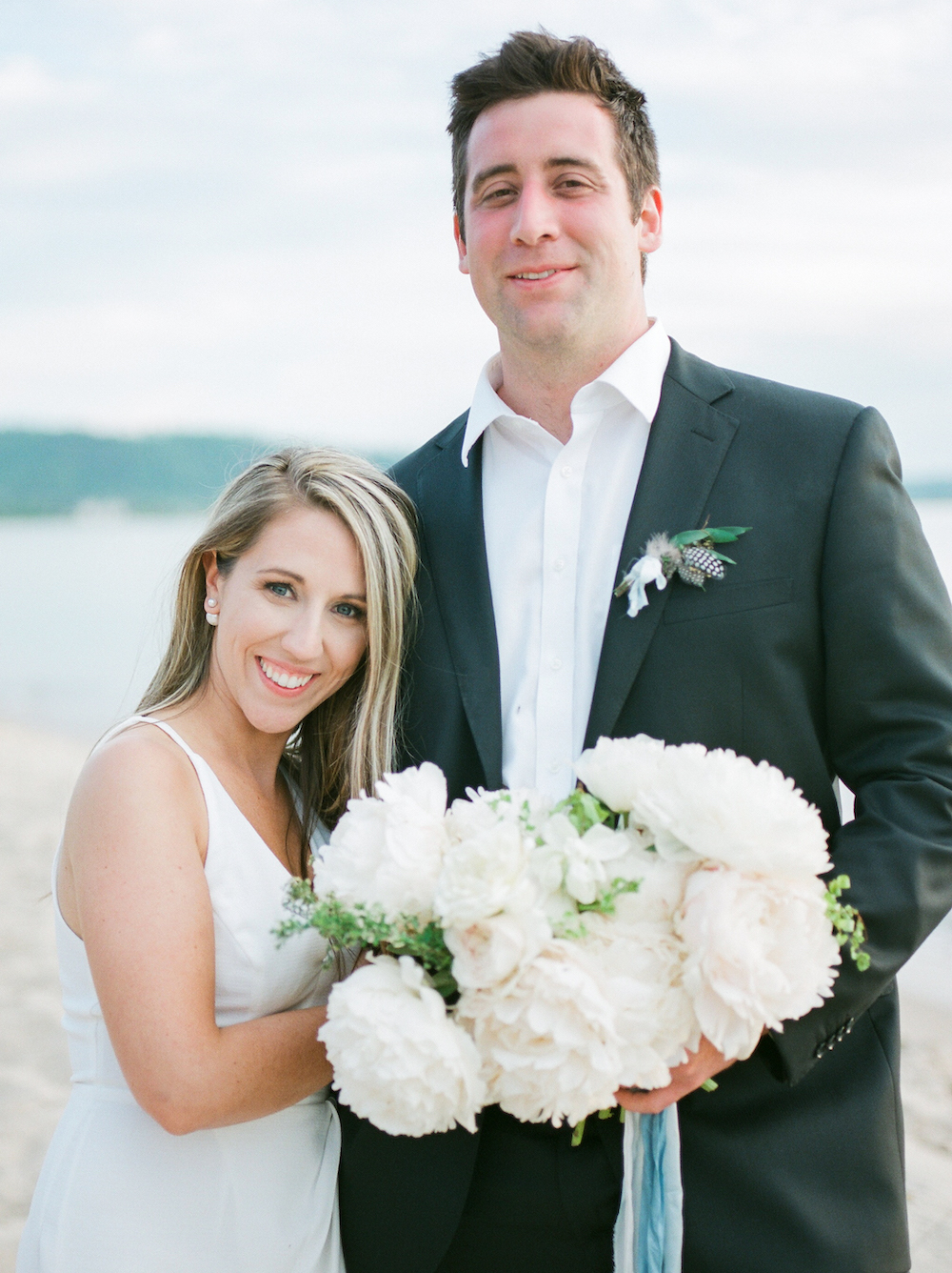 A couple smiling on the beach