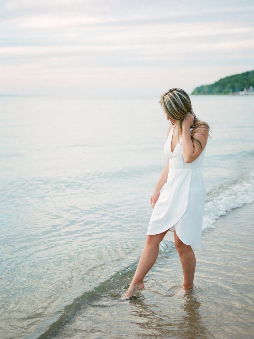 A bride dipping her toe in the water