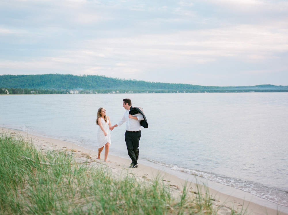 A couple running on the beach