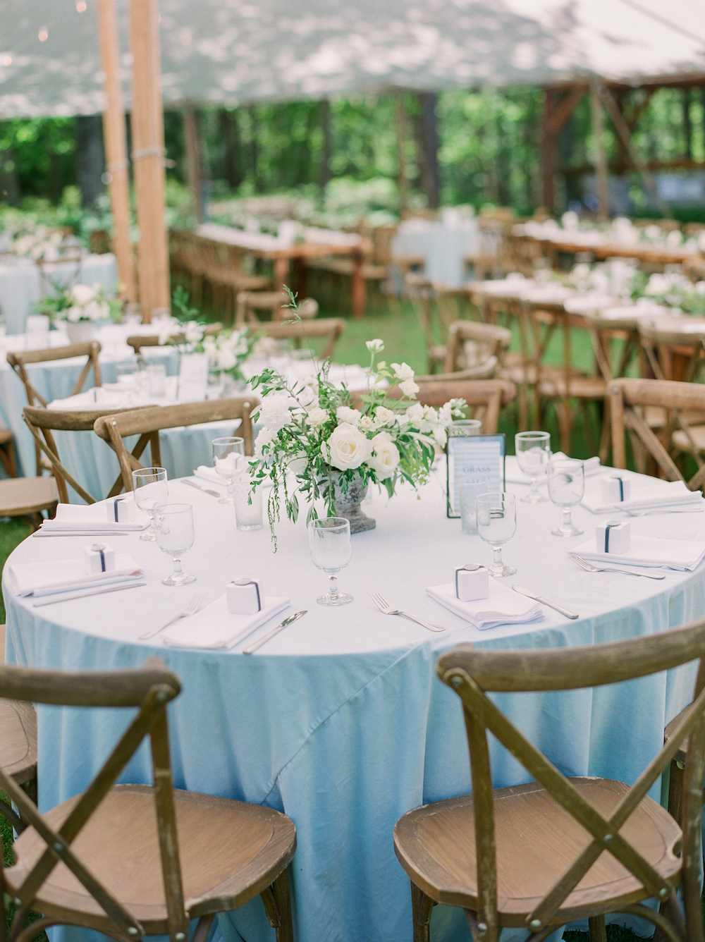 Tables set for a tented wedding in Glen Arbor, Michigan