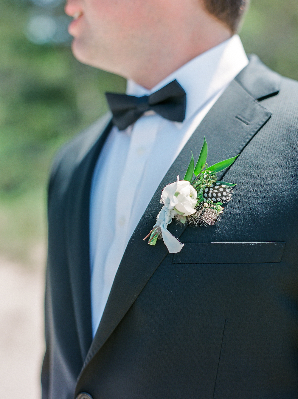 A feather boutonnière 