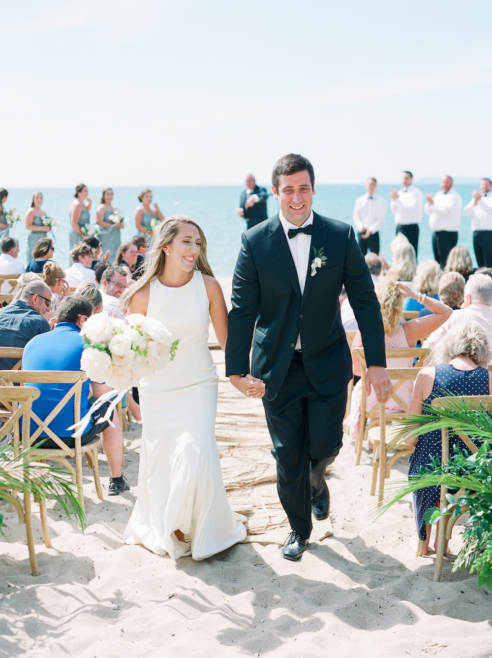 A couple smiling after their Glen Arbor, Michigan wedding