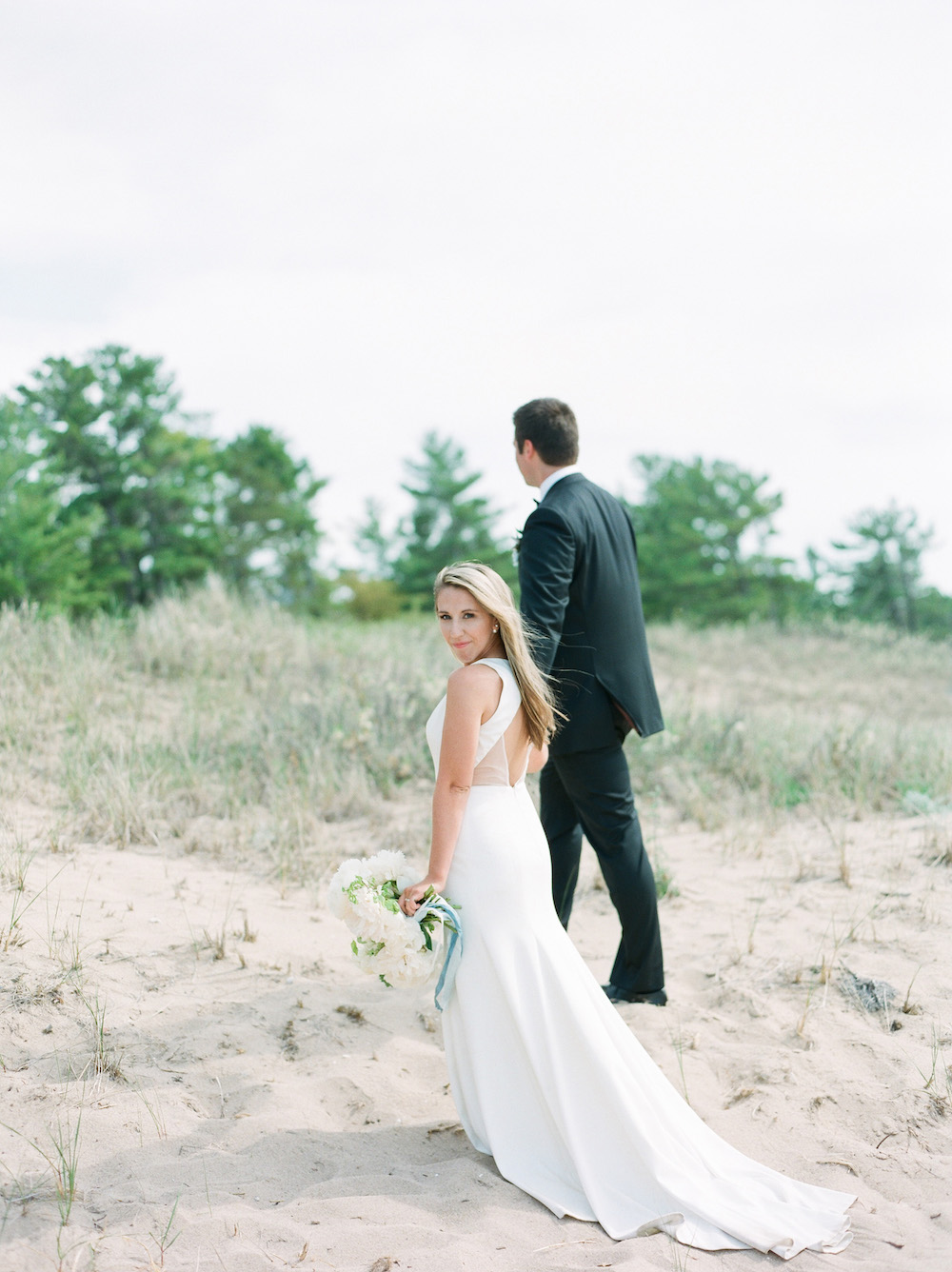 Couple on the beach during their Glen Arbor, Michigan wedding