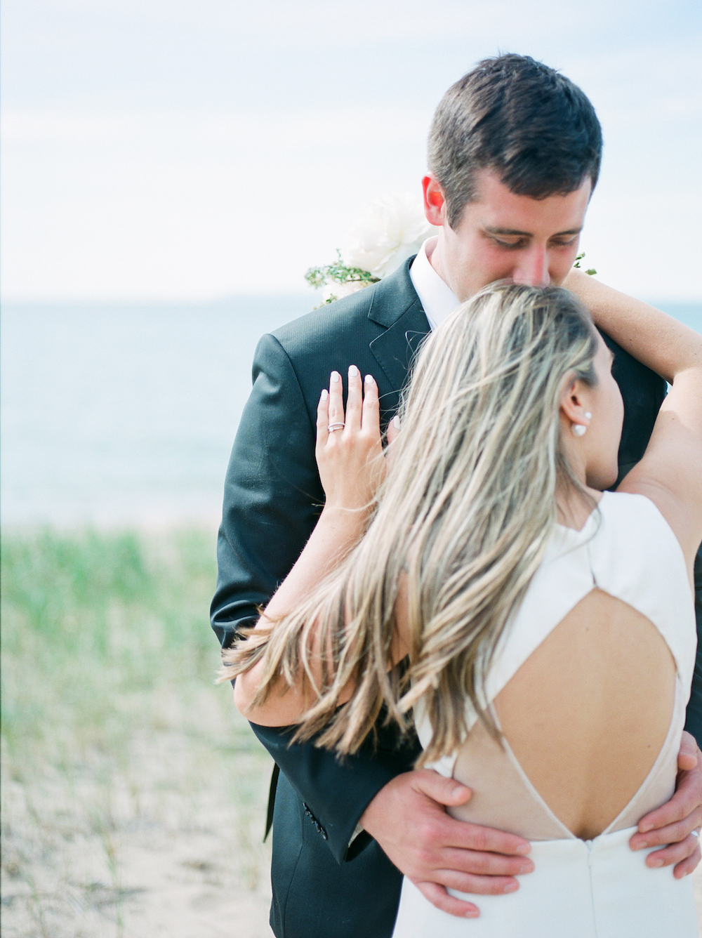 A couple on the beach during their wedding