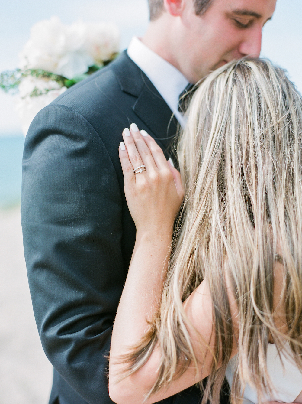 A bride and groom on the beach