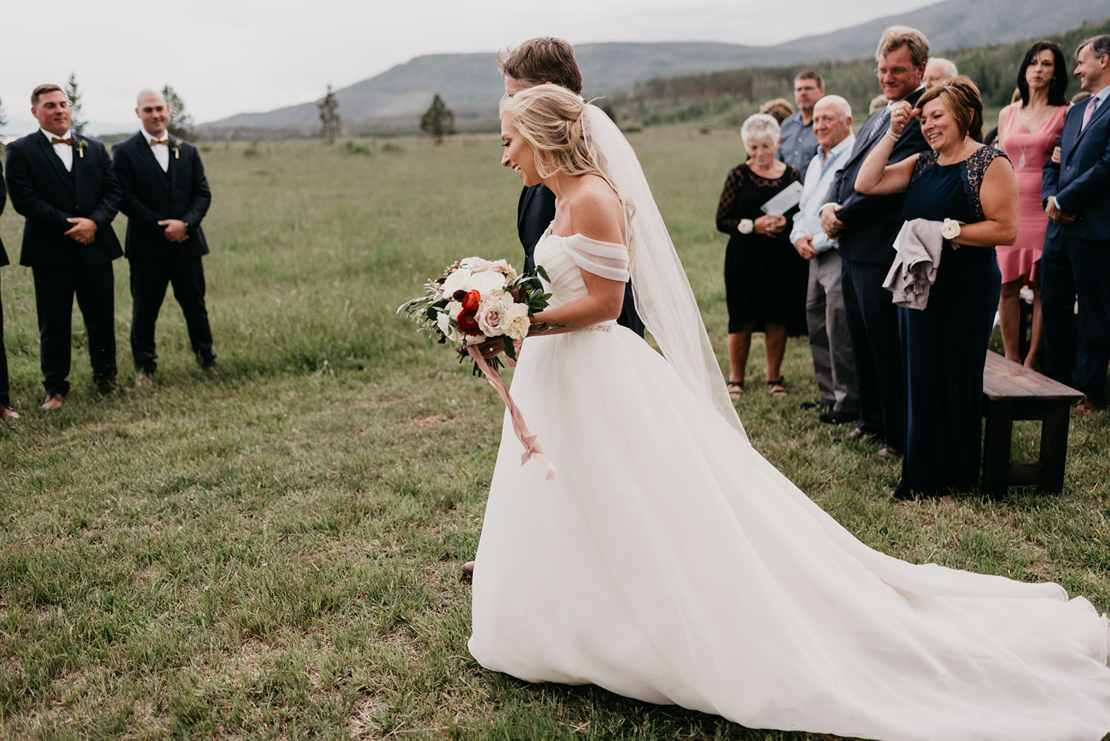 A bride walking down the aisle with her dad