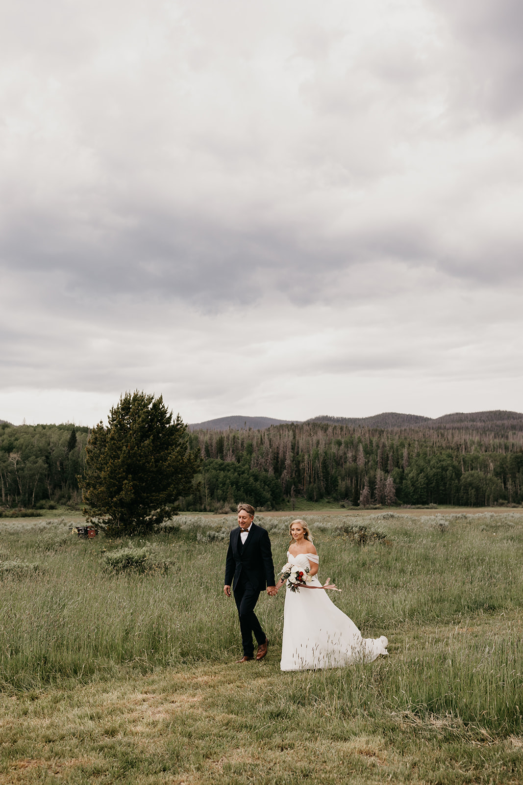 A bride and her dad walking down the aisle