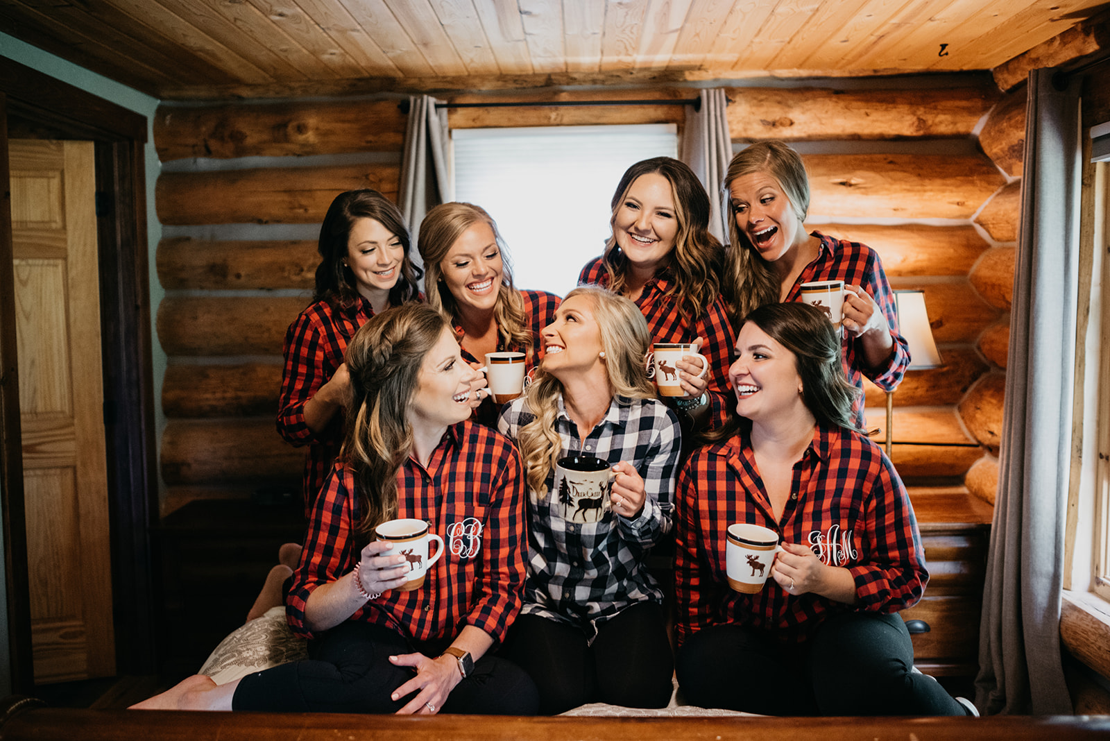 Bride and bridesmaids getting ready in a log cabin