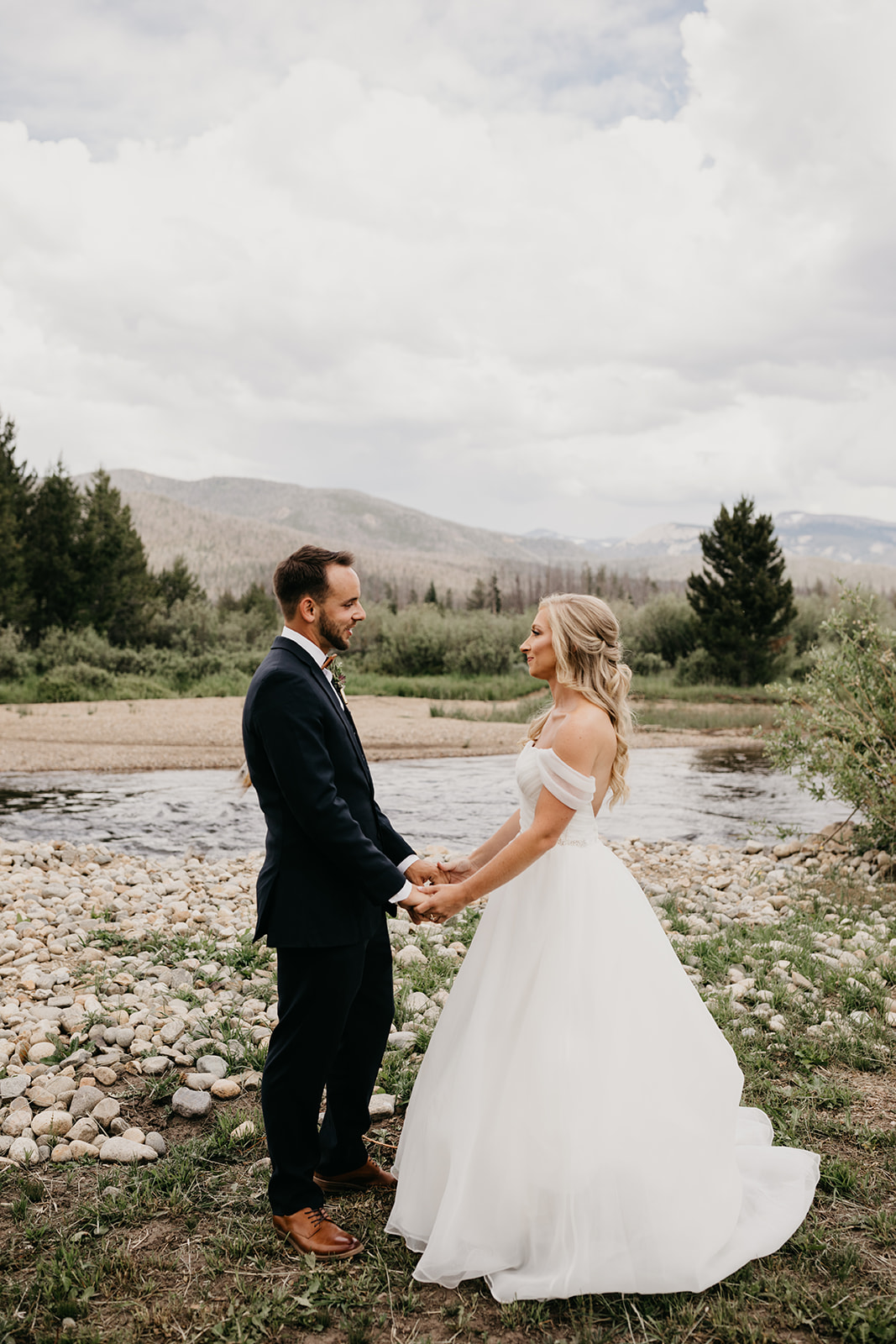 Couple smiling before their Colorado mountain wedding