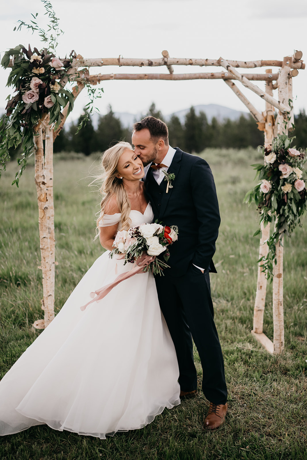 A couple smiling after their Colorado wedding