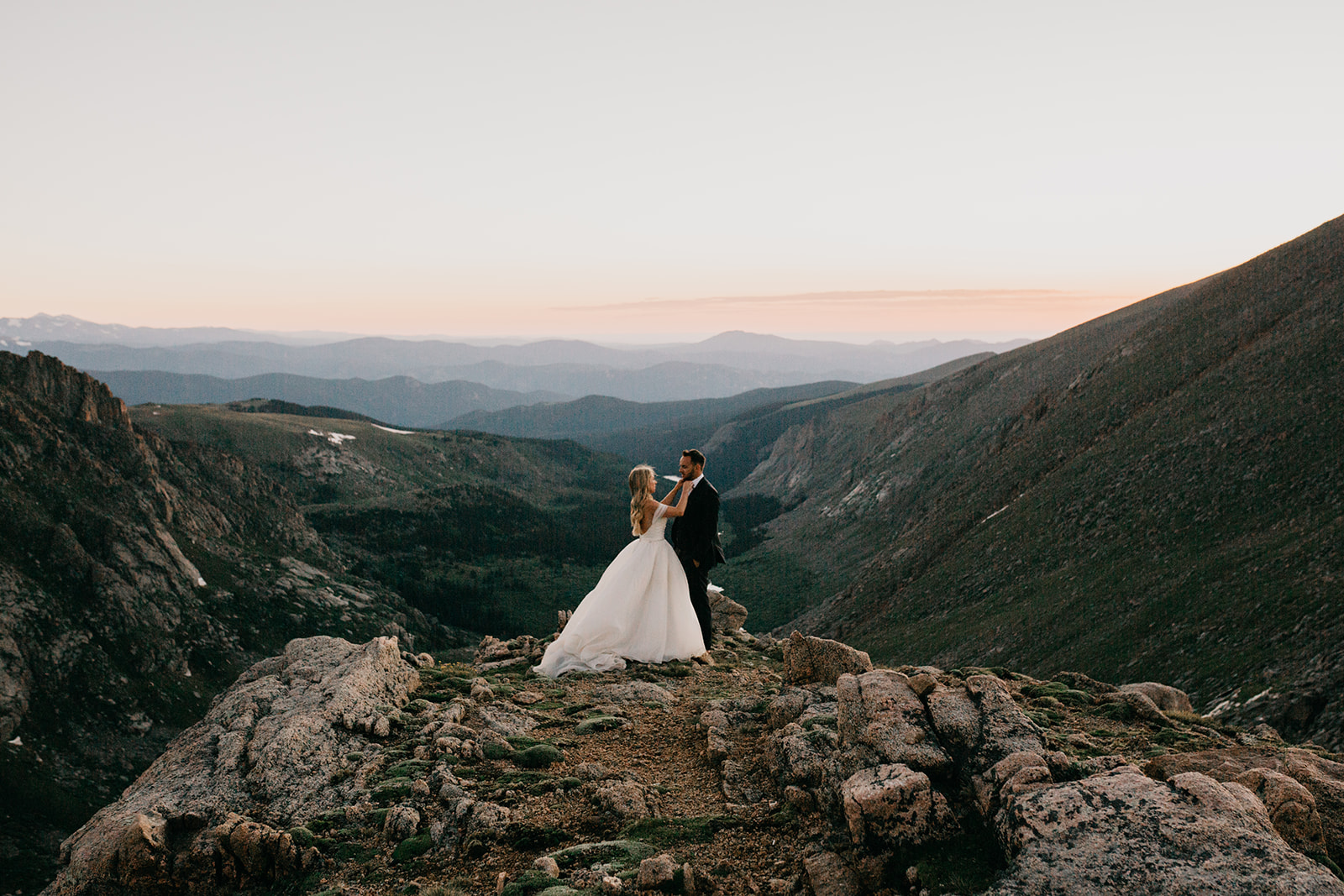 Couple enjoying the sunset during their rocky mountain wedding