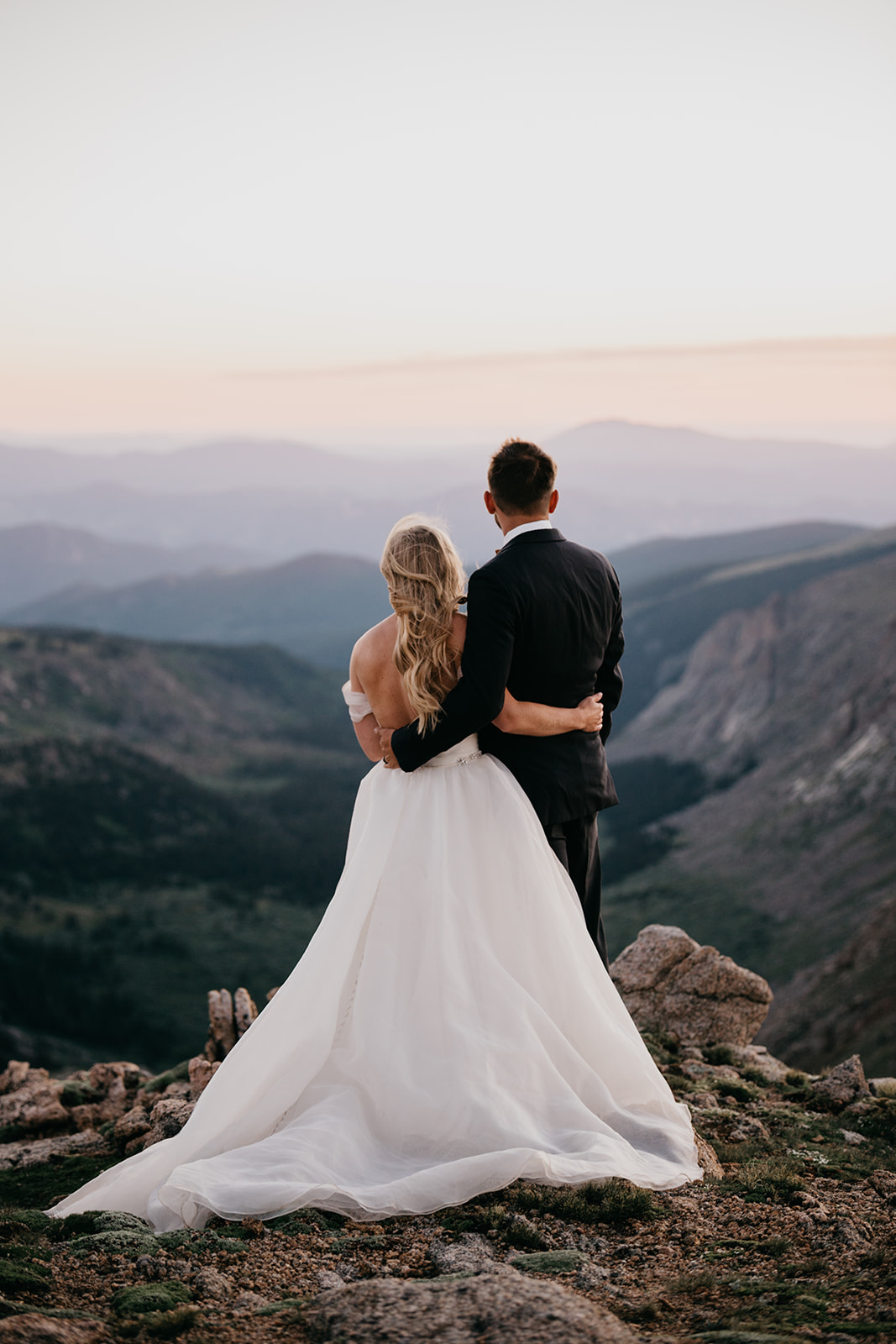 Couple enjoying the sunset during their Rocky Mountain wedding