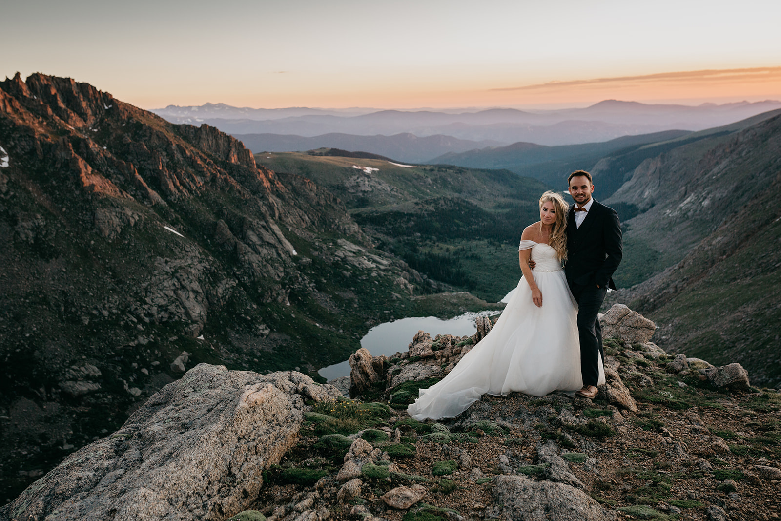 Couple enjoying the sunset during their mountain wedding