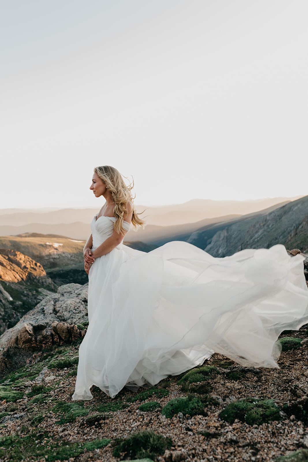 Bride enjoying sunset during her rocky mountain wedding