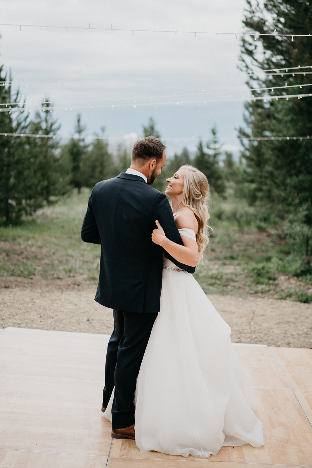 Couple sharing their first dance during their Colorado mountain wedding
