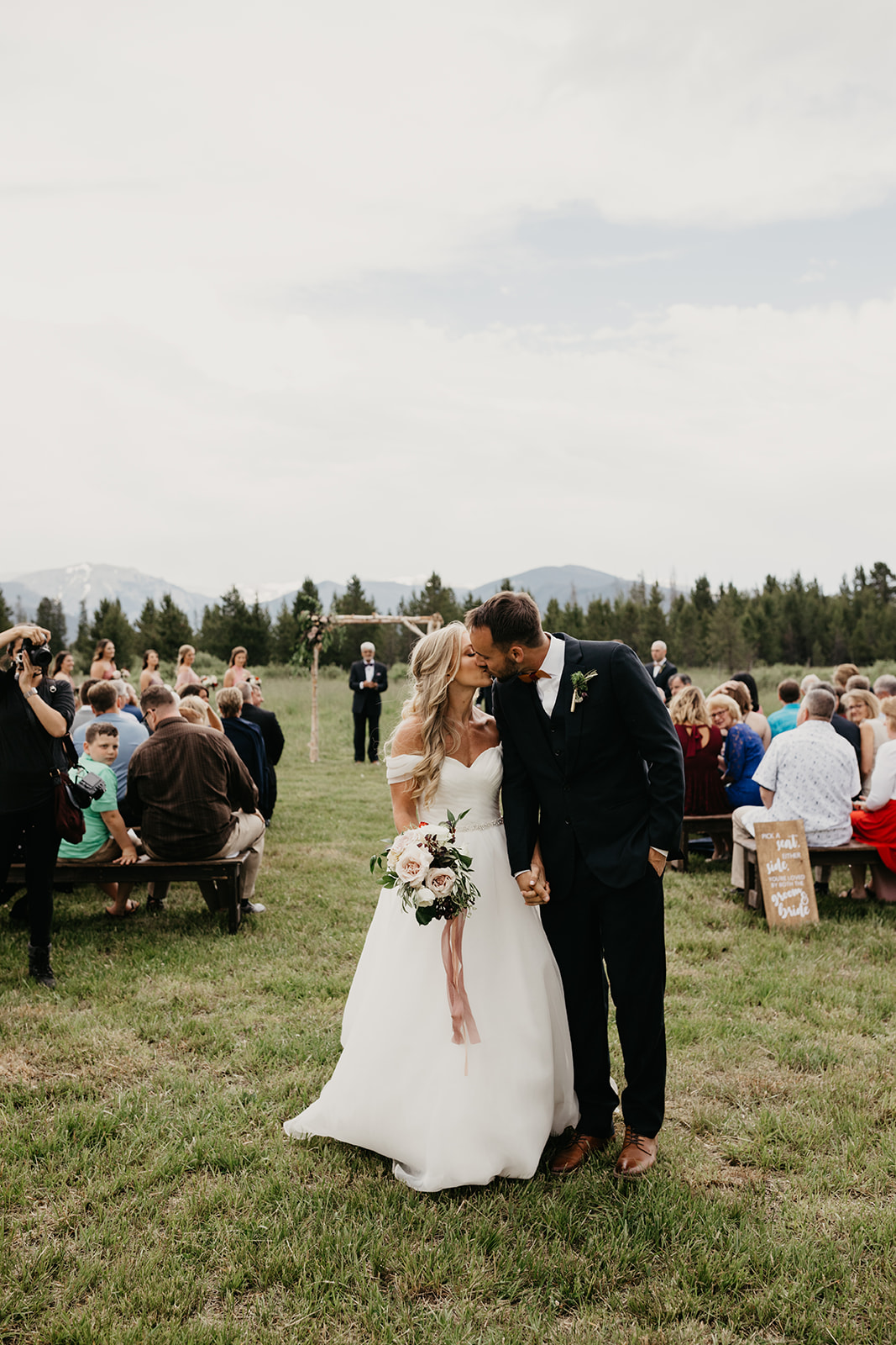 A couple sharing their first kiss as husband and wife