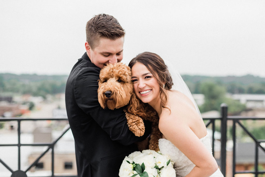 A couple and their dog before their downtown kalamazoo wedding