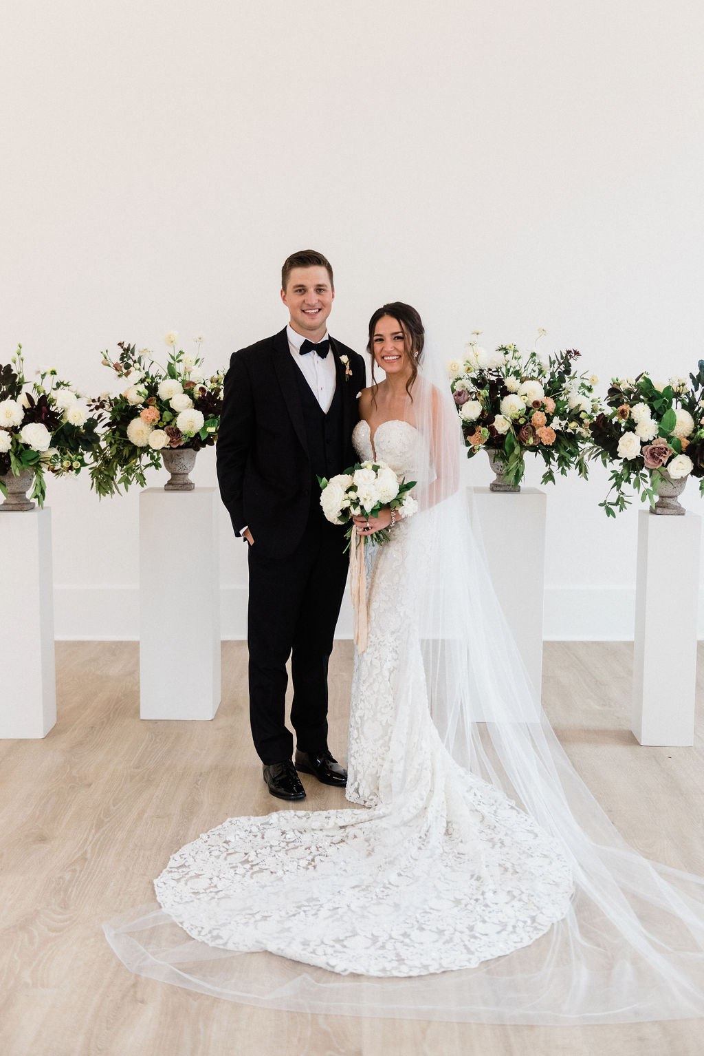 A couple smiling after their wedding ceremony