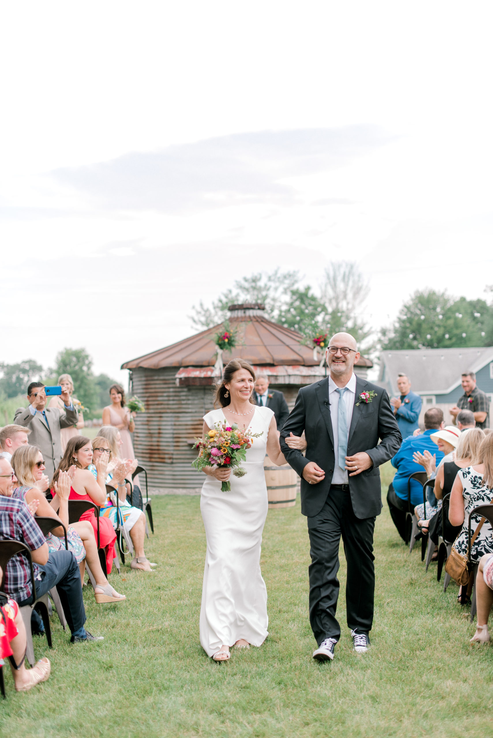 A couple smiling after their Journeyman Distillery wedding ceremony