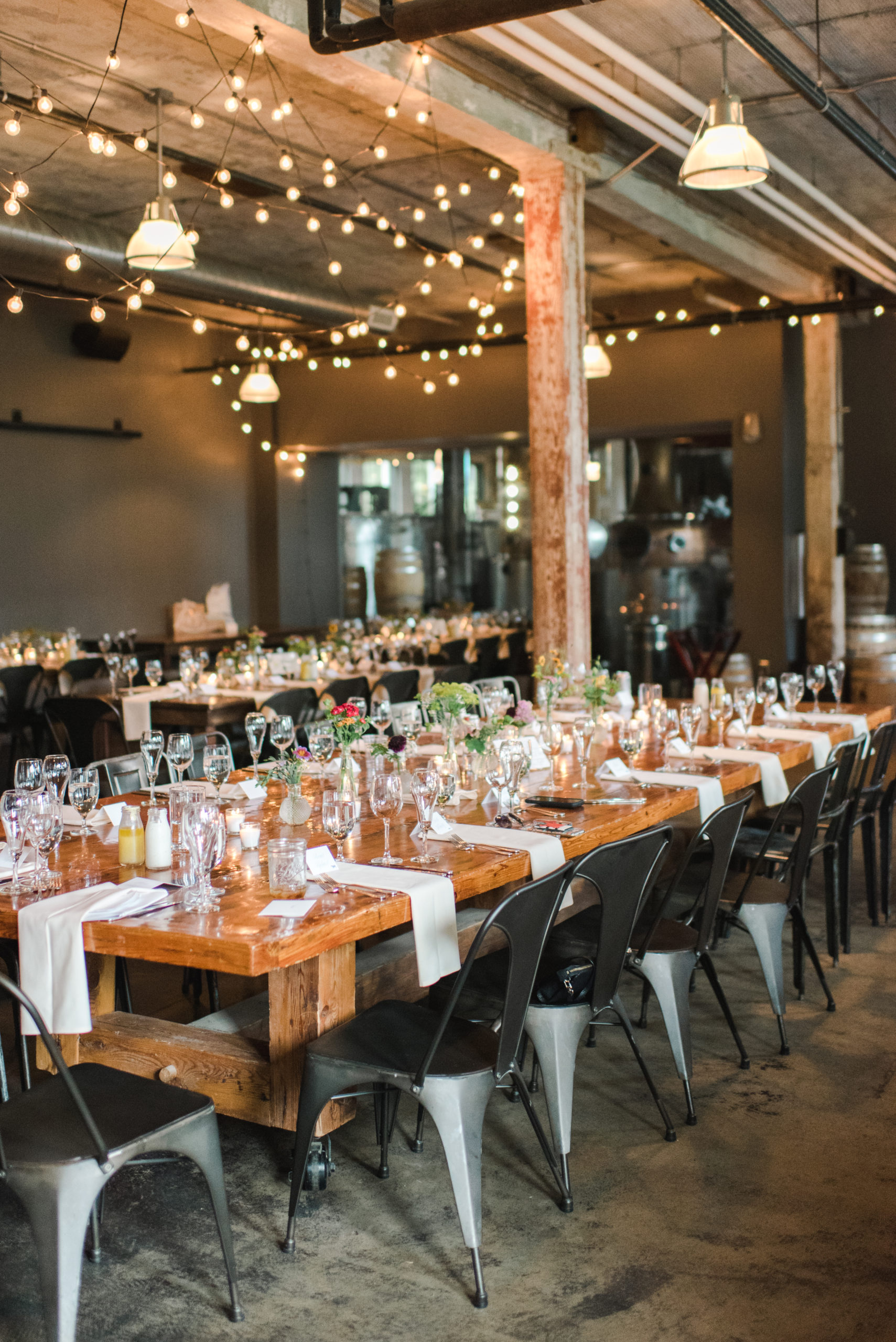 Tables set for a Journeyman Distillery wedding