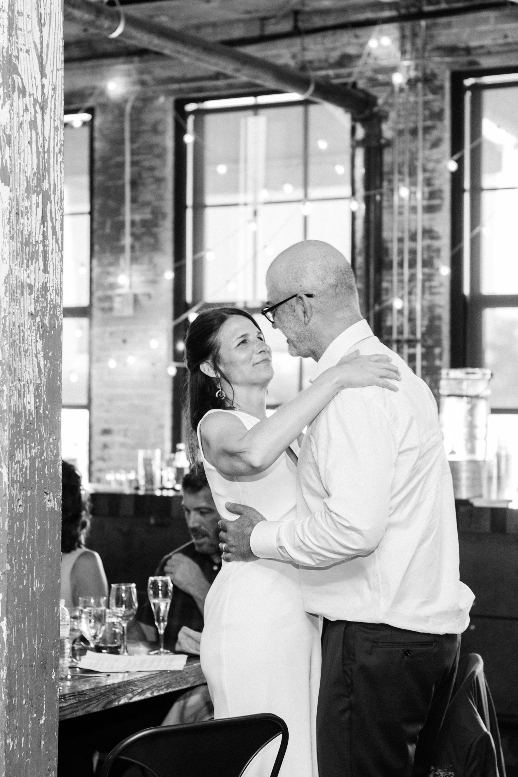 A couple smiling at their wedding