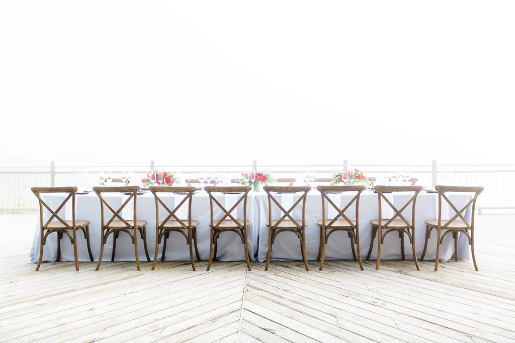 Table set on the deck for Camp Blodgett wedding in West Olive, Michigan