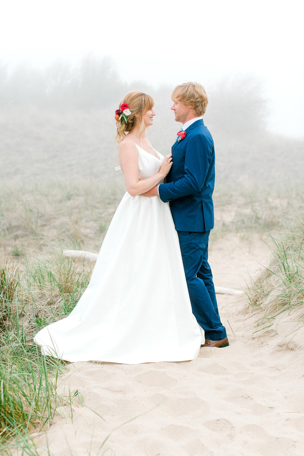 Couple smiling during their beach wedding on Lake Michigan