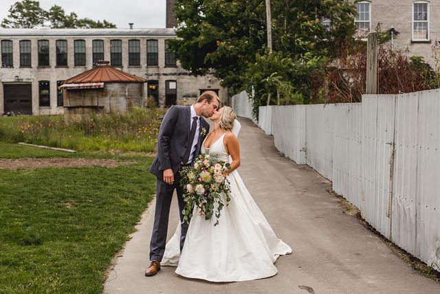 Bride and groom kissing at their Southwest Michigan wedding venue