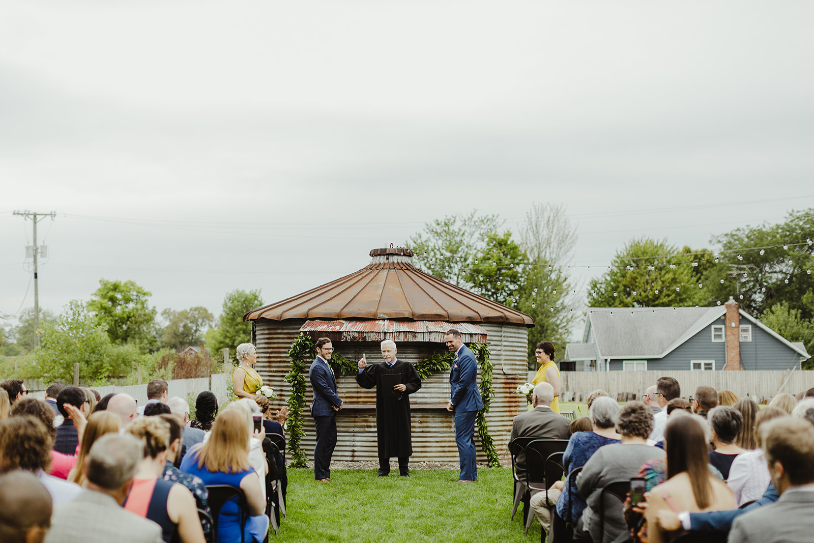 Grooms getting married during a Journeyman Distillery wedding