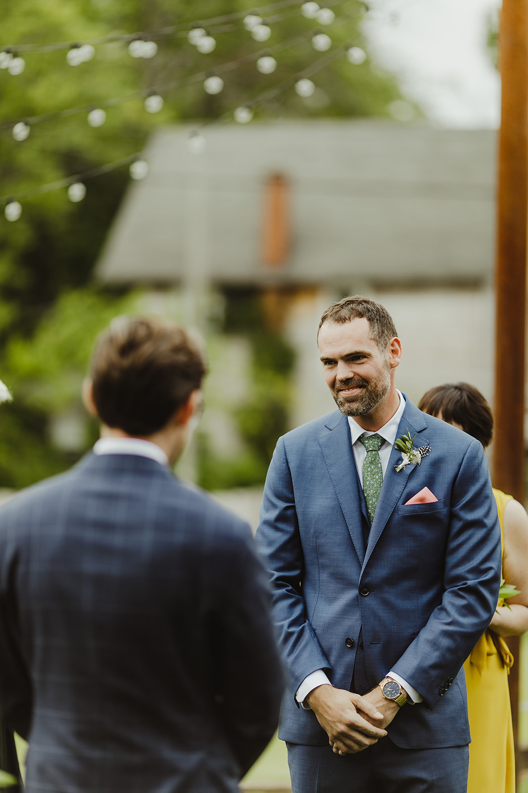 Groom smiling during his wedding