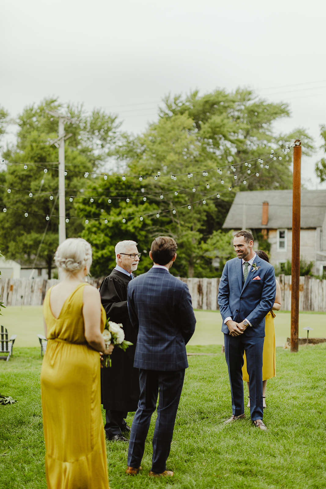 Grooms smiling during their Three Oaks, MI wedding