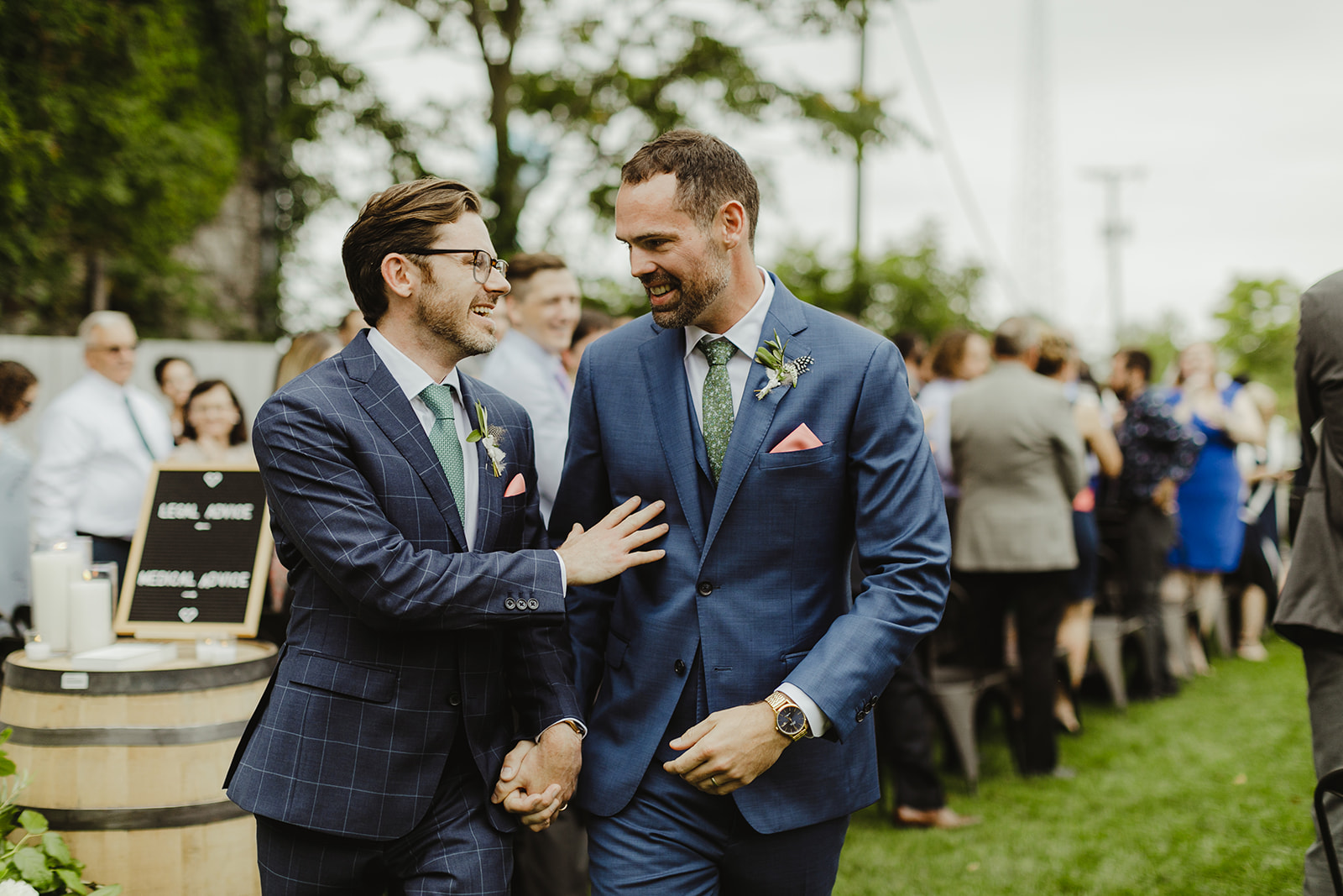 Grooms celebrating after their wedding ceremony