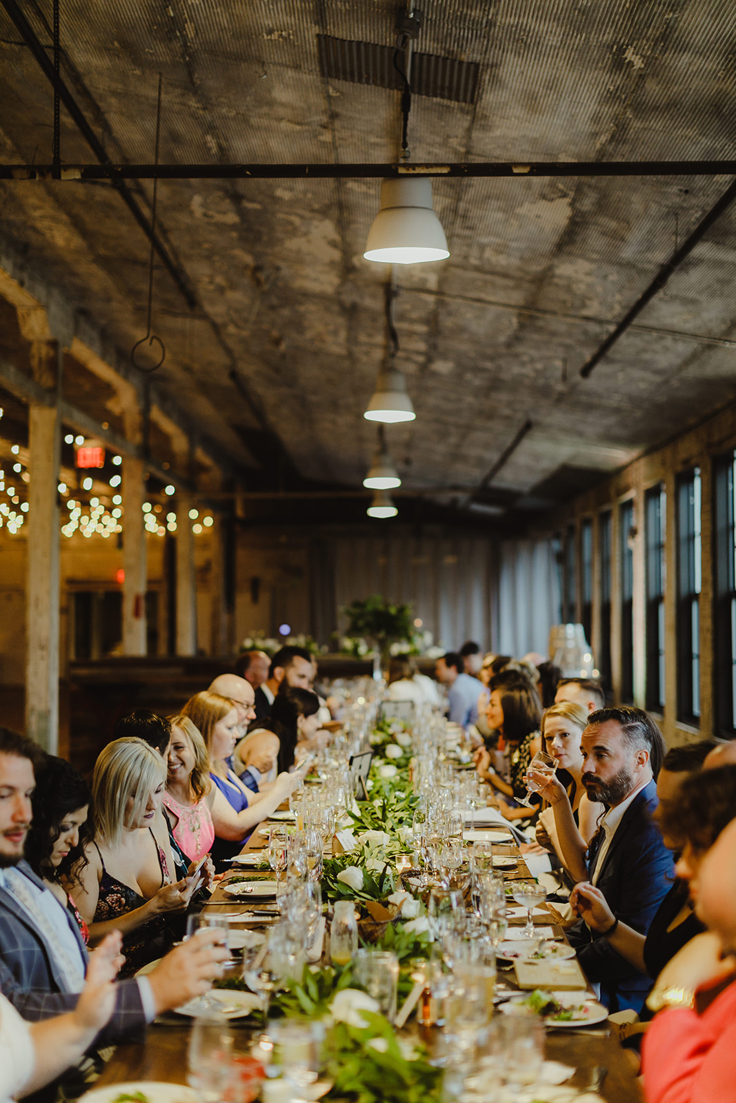 Guests enjoying dinner during a Journeyman Distillery wedding