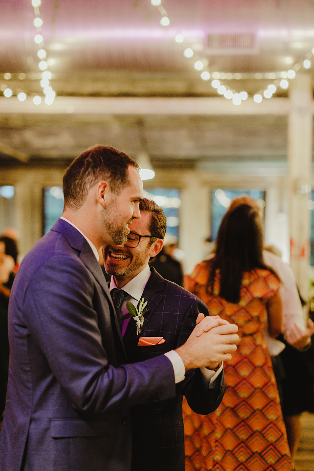 Grooms enjoying a dance