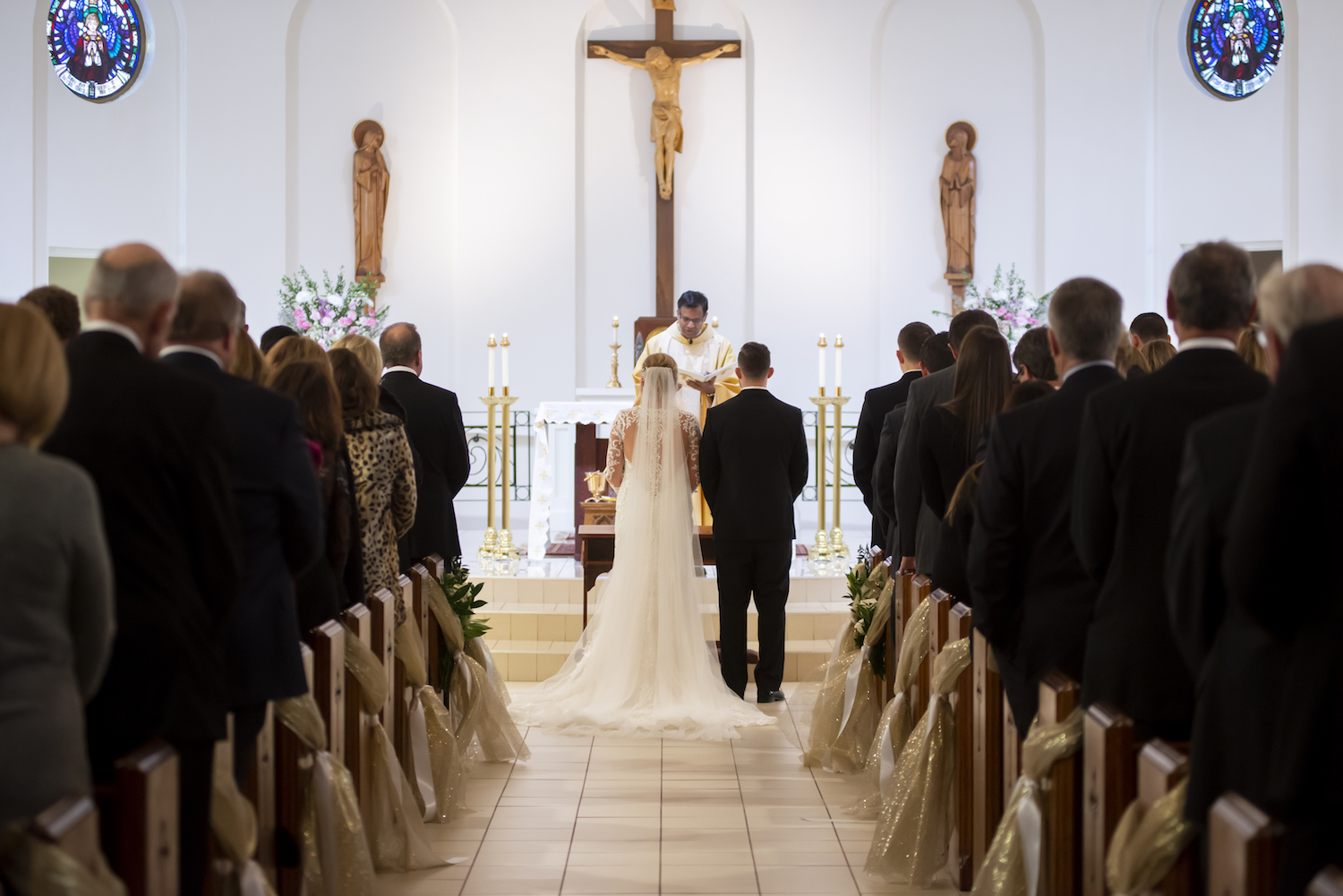 Bride and groom standing at alter