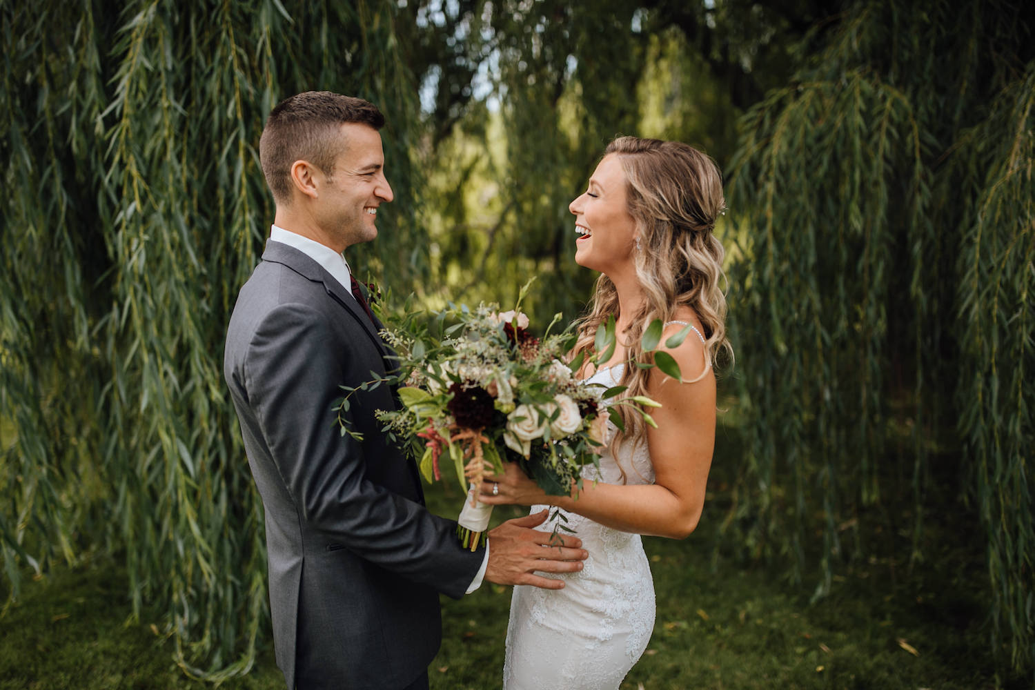 Bride and Groom smiling at first look