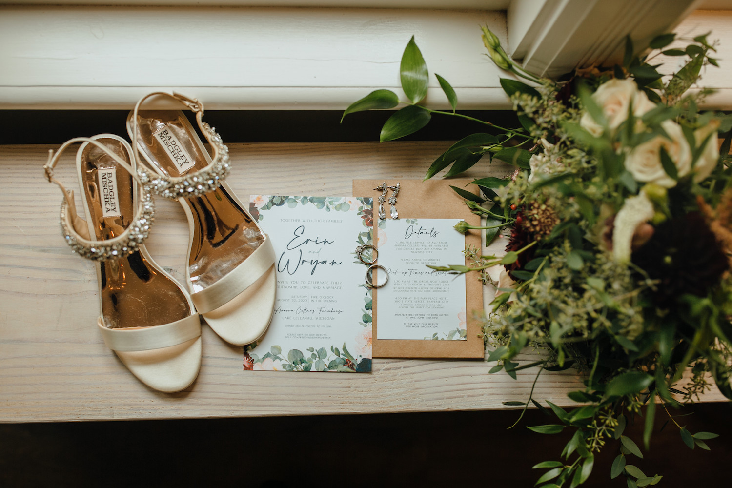 Detail shot of brides shoes, bouquet, and rings