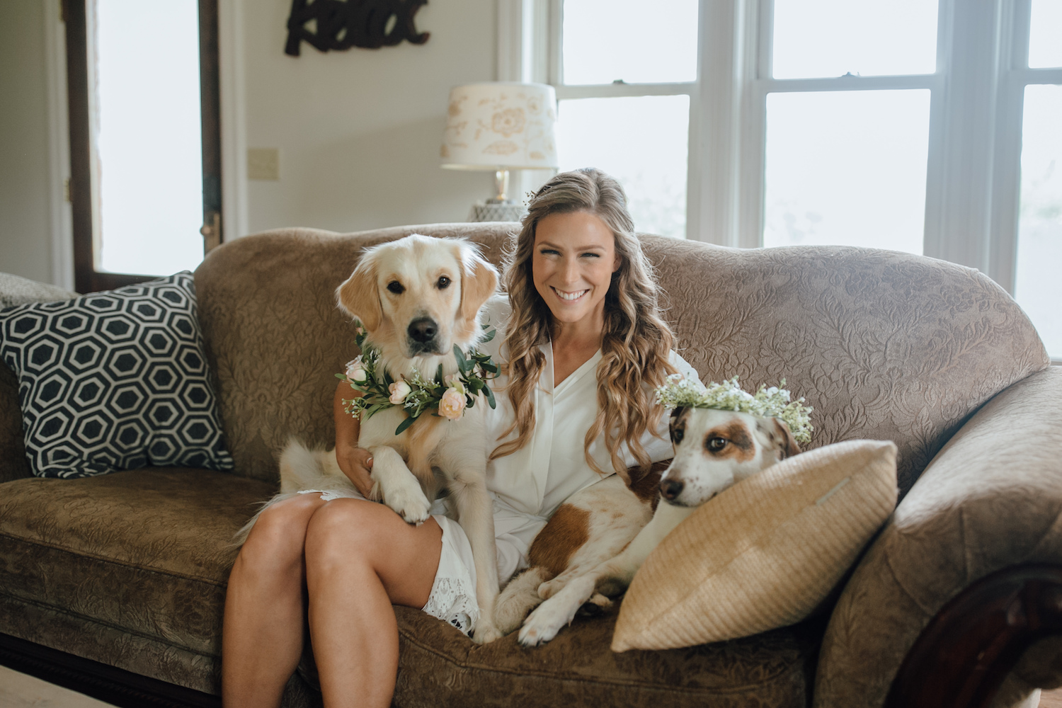 Bride smiling with her dogs