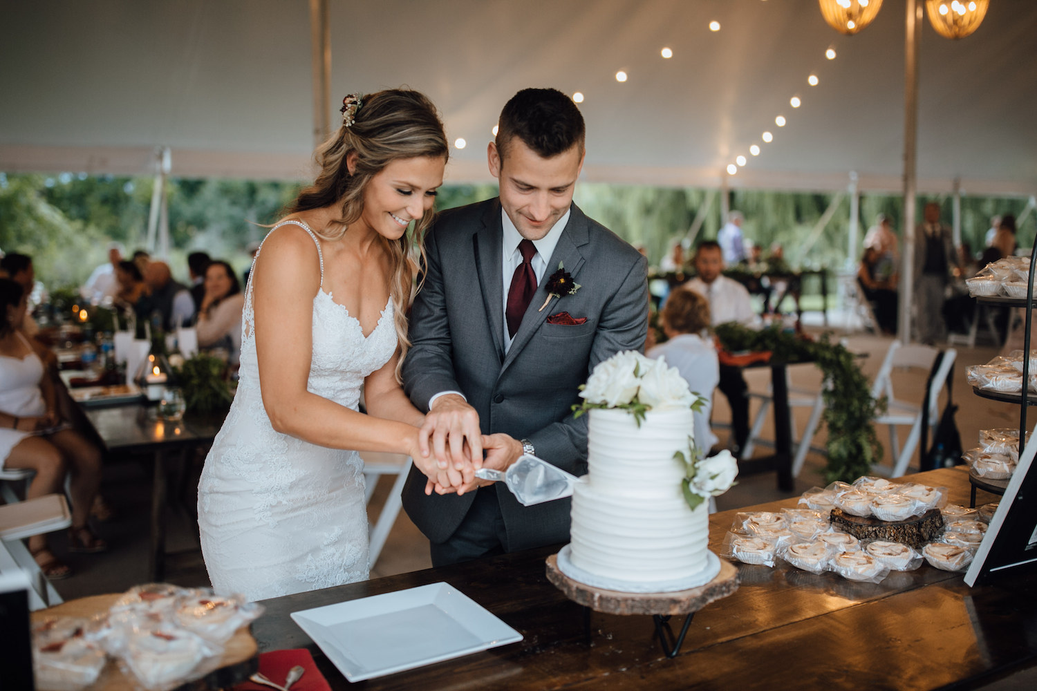 Bride and groom cutting cake at their aurora cellars wedding