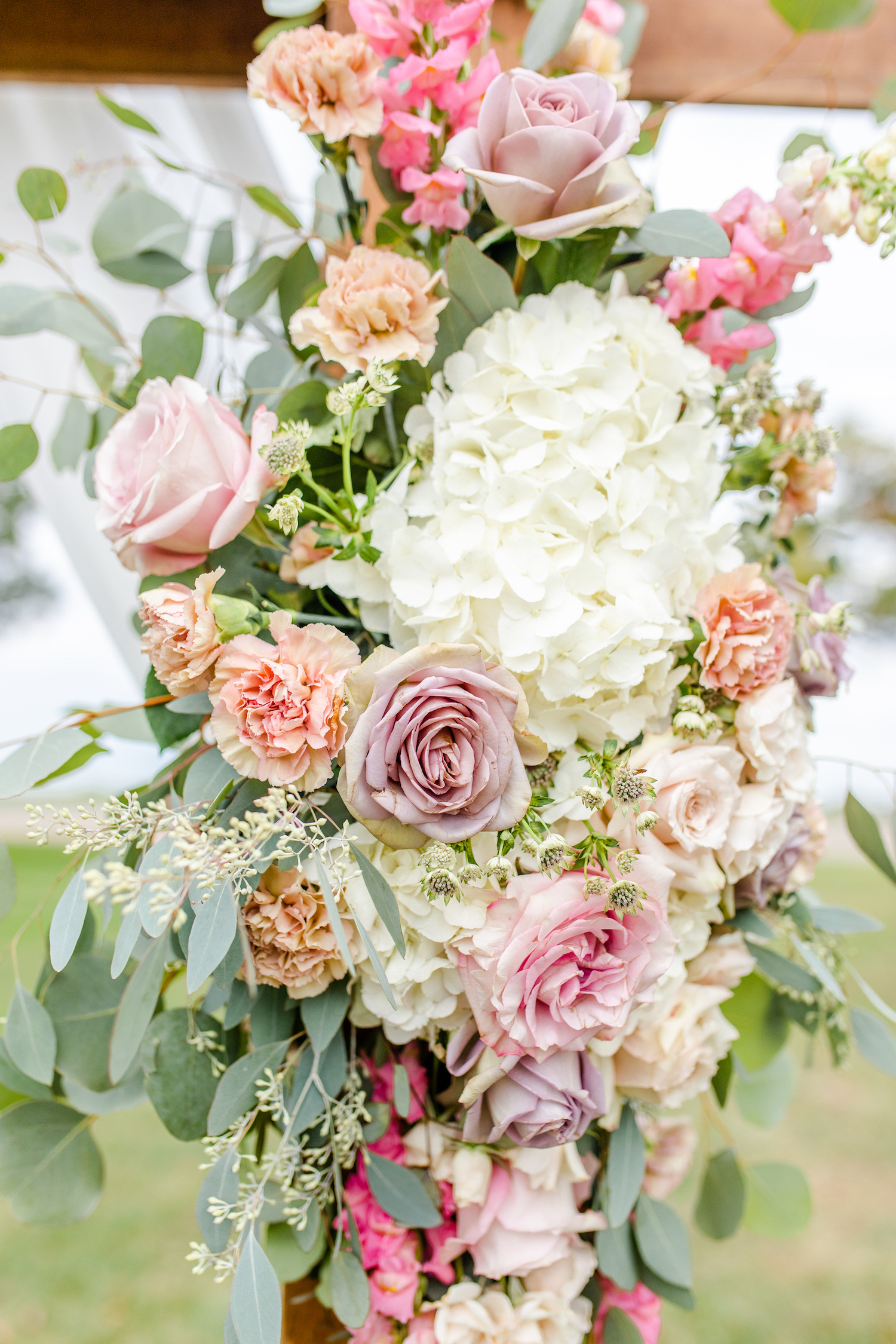 Flowers on arch for the lakehouse wedding